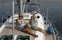 Mother and Daughter sittiong on deck of a Sailing boat